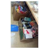 2 boxes of vhs and miscellaneous toys
