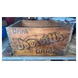 Nesbit orange soda crate with old weights