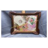 Framed vintage baby items and greeting cards