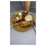 Vintage perfume bottles in amber dish