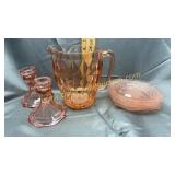 Pink depression pitcher, candle stands and