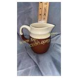 White and brown stoneware pottery small pitcher
