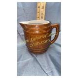 Brown stoneware barrel pitcher
