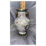 Brass vase with elephant heads dent on one side