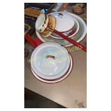 Group of white and red enamel ware