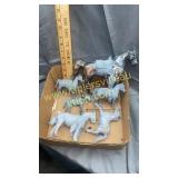 Box of cast metal horses