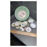 Collection of butter pat dishes and bowl