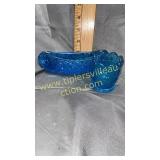 Blue daisy and button toothpick and canoe