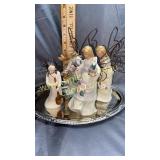 One willow tree and 3 look alike angels