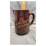 Brown stoneware grape pitcher