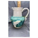 Pottery pitcher with fish