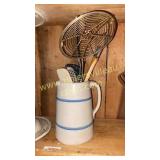 Blue band stoneware pitcher with kitchen utensils
