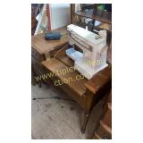 Singer sewing machine in nice maple cabinet