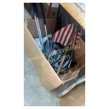 Box with golf clubs and leaf blower