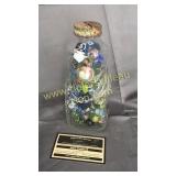 Grapette bottle bank with marbles