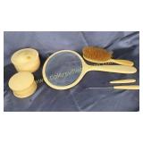 Celluloid dresser mirror, powder jars, brush and