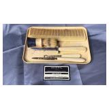 Celluloid dresser set- comb, nail knife button