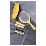 Celluloid mirror, clothes brush, shoe hooks