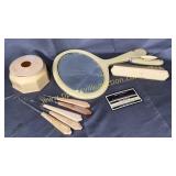 Celluloid mirror, hair receiver, brushes and shoe