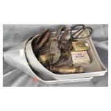 Farm pans with old tools, clippers and meds