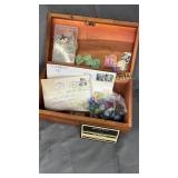 Old stamps and marbles in lane cedar box