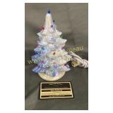 Small ceramic lighted Christmas tree missing a