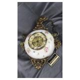 Vintage 8 day jeweled hanging clock one side