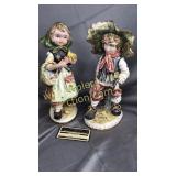 Vintage boy and girl statues