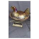 Carnival hen on nest