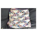 Old hand made triangle quilt some discoloration