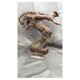 Carved cowboy statue