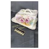 Old cheese dish with irises