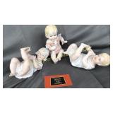 3 hand painted baby figurines