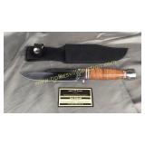 Steel warrior knife in scabbard