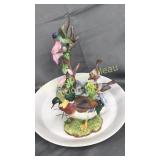 3 bird figurines on mallard plate