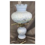 Blue painted lamp paint is chipped