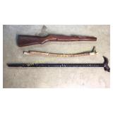 2 walking sticks and gun stock