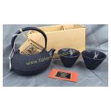 Cast iron tea kettle and cups