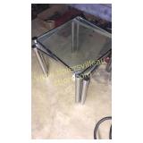 Pair of chrome and glass top tables