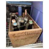 Wood crate of whiskey and beer bottles