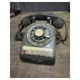 Black rotary office telephone