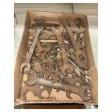 Box of early automotive and tractor wrenches
