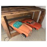 Two vintage plastic cars and crate