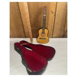 Vintage promotional miniature acoustic guitar and