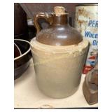 Gallon stoneware jug has cracks and chips
