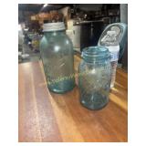 Two blue fruit jars