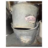 Two feed buckets