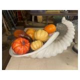 Ceramic cornucopia with artificial pumpkins and