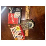 Compass, hand warmer and coin bank