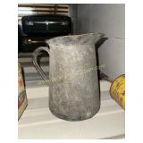 Primitive tin pitcher
